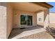 Covered outdoor patio area with sliding glass door leading to backyard at 7824 Pine Warbler Way, North Las Vegas, NV 89084