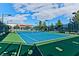 Outdoor community tennis court with professional blue and green surface under a sunny sky at 7824 Pine Warbler Way, North Las Vegas, NV 89084
