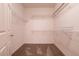 Organized walk-in closet with shelving and carpet flooring at 7824 Pine Warbler Way, North Las Vegas, NV 89084