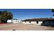 A spacious lot with a white home, some trees, and an RV parked on the side at 7990 Firethorn, Las Vegas, NV 89123