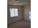Bedroom with carpeting, blinds and a ceiling light at 7990 Firethorn, Las Vegas, NV 89123