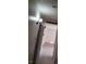Hallway with tile flooring, lighting fixture, and neutral paint at 7990 Firethorn, Las Vegas, NV 89123