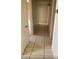 Hallway with tile flooring and white walls leading to various rooms at 7990 Firethorn, Las Vegas, NV 89123