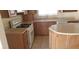 A nicely appointed kitchen with wood cabinetry and granite countertops at 7990 Firethorn, Las Vegas, NV 89123