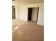 Bright living room boasts tile and carpet flooring, and neutral wall color at 7990 Firethorn, Las Vegas, NV 89123
