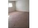 Living room features neutral carpet and white walls illuminated by a window at 7990 Firethorn, Las Vegas, NV 89123