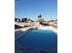Backyard featuring a blue swimming pool with surrounding patio and block wall at 7990 Firethorn, Las Vegas, NV 89123