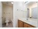 Compact bathroom featuring a single vanity, tile flooring, and a shower-tub combination at 824 Bussora Rose Dr, Henderson, NV 89015