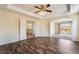 Large primary bedroom with hardwood floors, connecting to bath and balcony at 824 Bussora Rose Dr, Henderson, NV 89015