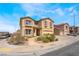 Inviting two-story home showcasing neutral color scheme, neat landscaping, and ample driveway parking at 824 Bussora Rose Dr, Henderson, NV 89015