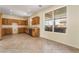 Bright kitchen featuring wood cabinets and a large window overlooking the backyard at 824 Bussora Rose Dr, Henderson, NV 89015