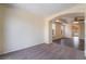 Spacious living room featuring neutral carpeting, archway, and an abundance of natural light at 824 Bussora Rose Dr, Henderson, NV 89015