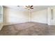 Spacious living room with tile flooring and neutral walls, ready for personalization at 824 Bussora Rose Dr, Henderson, NV 89015