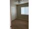 Bedroom with neutral walls, carpet, and a closet at 8664 Traveling Breeze Ave # 102, Las Vegas, NV 89178