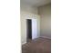 Bedroom with a closet featuring a sliding door at 8664 Traveling Breeze Ave # 102, Las Vegas, NV 89178