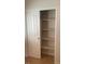 Bedroom closet with sliding doors and multiple shelves for organized storage solutions at 8664 Traveling Breeze Ave # 102, Las Vegas, NV 89178