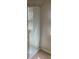 Standing shower featuring white tile and a glass door at 8664 Traveling Breeze Ave # 102, Las Vegas, NV 89178