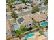 Suburban neighborhood with homes featuring solar panels, pools, and well-maintained landscaping at 8980 Tumbling Pebble Way, Las Vegas, NV 89123