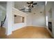 Bright and airy living room showcasing high ceilings, wood flooring, and a fireplace at 8980 Tumbling Pebble Way, Las Vegas, NV 89123