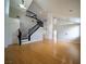 Open floor plan showcasing wood flooring, a staircase, and a spacious living area at 8980 Tumbling Pebble Way, Las Vegas, NV 89123