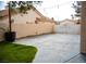 Spacious open patio surrounded by green grass, privacy walls, and easy access to the house at 8980 Tumbling Pebble Way, Las Vegas, NV 89123