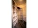 Well-organized walk-in closet with built-in shelving and drawers at 8980 Tumbling Pebble Way, Las Vegas, NV 89123