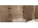 Tiled shower and tub featuring tile bench and corner shelves at 9000 Las Vegas Blvd # 1015, Las Vegas, NV 89123