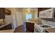 Kitchen featuring granite countertops, white gas burning range, dark cabinets, and white appliances at 9000 Las Vegas Blvd # 1015, Las Vegas, NV 89123
