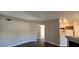Open-concept living space with views of the kitchen and dark brown wood laminate flooring at 9000 Las Vegas Blvd # 1015, Las Vegas, NV 89123
