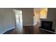 Open-concept living space with wood laminate flooring, fireplace, and views of the entryway at 9000 Las Vegas Blvd # 1015, Las Vegas, NV 89123