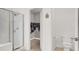 Bright bathroom with a glass-enclosed shower, walk-in closet and modern toilet at 9049 Teetering Rock Ave, Las Vegas, NV 89143