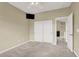 Comfortable bedroom featuring a ceiling fan, closet, and an ensuite bathroom for added convenience and privacy at 9049 Teetering Rock Ave, Las Vegas, NV 89143