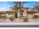 Charming two-story home featuring a dual garage, desert landscaping, and a welcoming facade with neutral color palette at 9049 Teetering Rock Ave, Las Vegas, NV 89143
