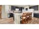 Modern kitchen with dark cabinets, light countertops, and stainless steel appliances at 9049 Teetering Rock Ave, Las Vegas, NV 89143