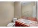 Powder room featuring a toilet and vanity with a ceramic tile countertop and dark wood cabinetry, with neutral wall color at 9073 Spoonbill Ridge Pl, Las Vegas, NV 89143