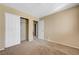 Cozy bedroom with a double door closet and neutral carpeting ready for your personal touch at 9073 Spoonbill Ridge Pl, Las Vegas, NV 89143