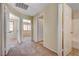 Upstairs hallway with multiple doors leading to bedrooms and bathrooms, featuring carpet flooring at 9073 Spoonbill Ridge Pl, Las Vegas, NV 89143