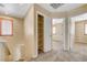 View from the top of the stairs of a bedroom and closet with neutral-toned walls at 9073 Spoonbill Ridge Pl, Las Vegas, NV 89143