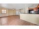 Open-concept room with tile flooring, a view of the stairs, and a kitchen counter at 9073 Spoonbill Ridge Pl, Las Vegas, NV 89143