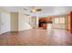 Open-concept room featuring a staircase, tile floors, and a kitchen at 9073 Spoonbill Ridge Pl, Las Vegas, NV 89143