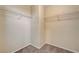 Spacious walk-in closet with carpet flooring and shelving to keep your wardrobe organized at 9073 Spoonbill Ridge Pl, Las Vegas, NV 89143
