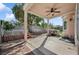 Picturesque backyard patio featuring decorative brick, a ceiling fan, and a built in spa at 9211 Golden Feather Ct, Las Vegas, NV 89147