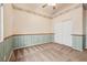 Inviting bedroom with paneled wainscoting, carpeted floors, and standard-size closet at 9211 Golden Feather Ct, Las Vegas, NV 89147