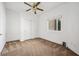 Neutral bedroom with carpet flooring, ceiling fan, and a window to provide natural light at 9211 Golden Feather Ct, Las Vegas, NV 89147