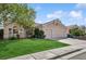 Well-manicured front lawn and neat landscaping enhance this attractive single-story home at 9211 Golden Feather Ct, Las Vegas, NV 89147