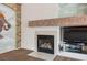 A close up of the fireplace with a marble mantle and built in niche for tv at 9211 Golden Feather Ct, Las Vegas, NV 89147