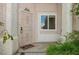 Inviting front entry with a secure gate and charming welcome mat at 9211 Golden Feather Ct, Las Vegas, NV 89147