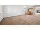 Expansive living room featuring a bar, carpeted floors, and an open layout at 9211 Golden Feather Ct, Las Vegas, NV 89147