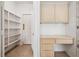 Pantry and built in desk with storage in kitchen/hallway at 9211 Golden Feather Ct, Las Vegas, NV 89147