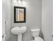Small half-bath with pedestal sink and commode at 9221 Steeltree St, Las Vegas, NV 89143